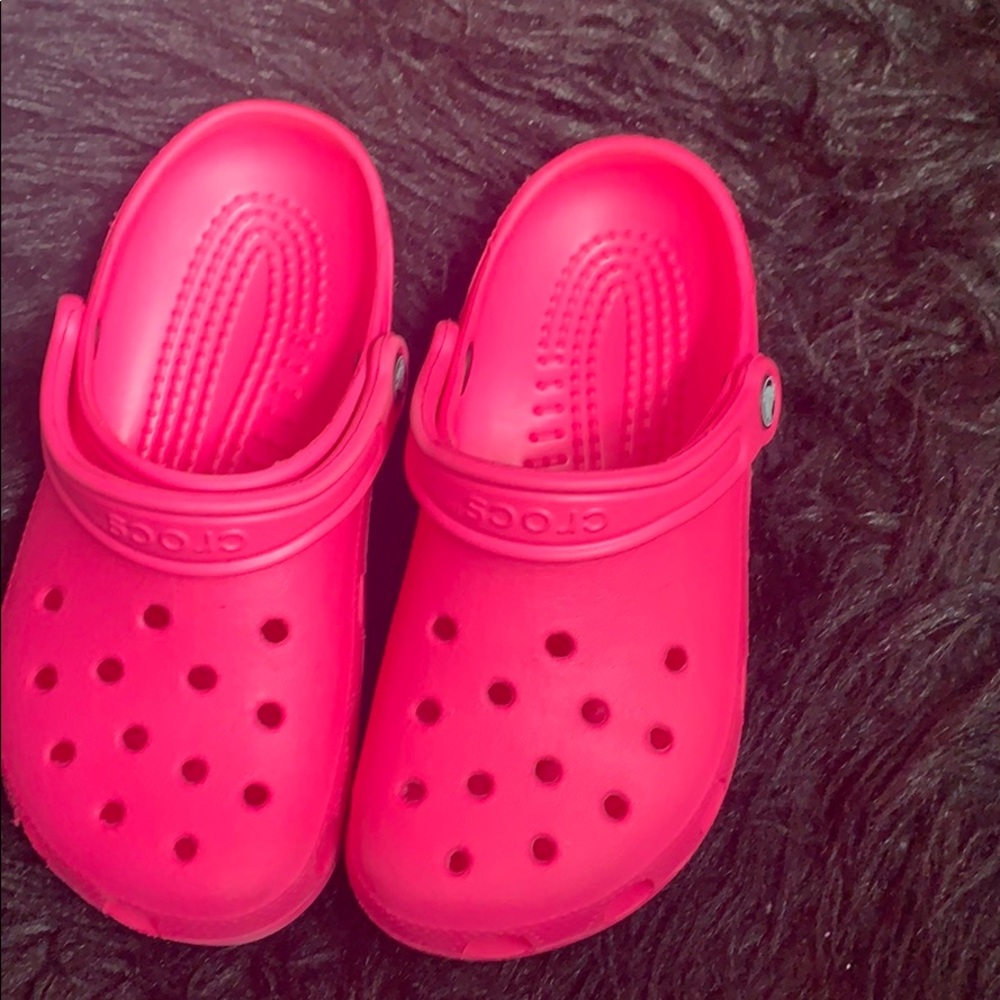 Hot pink crocs.